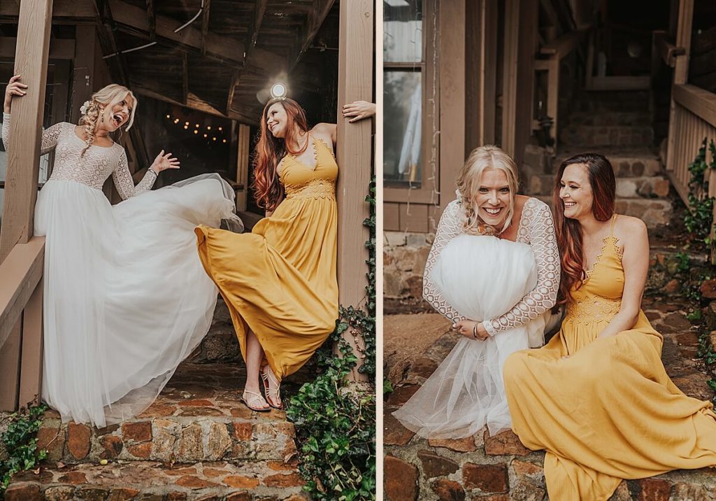 Boho bride and maid of honor in a yellow dress sitting on stone steps 