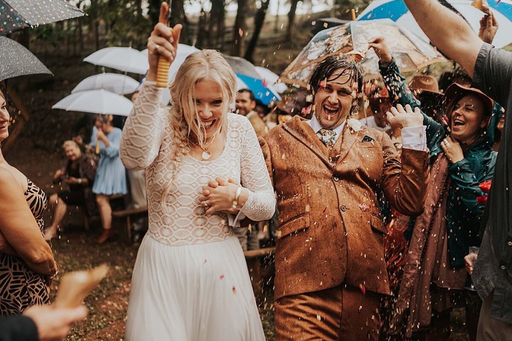 Bride and groom rainy outdoor recessional in Tennessee