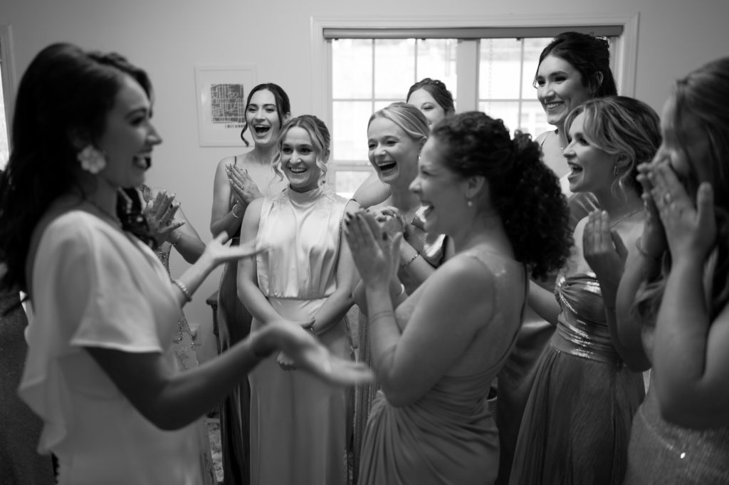 bridesmaid's reaction to seeing the bride is her wedding dress for the first time