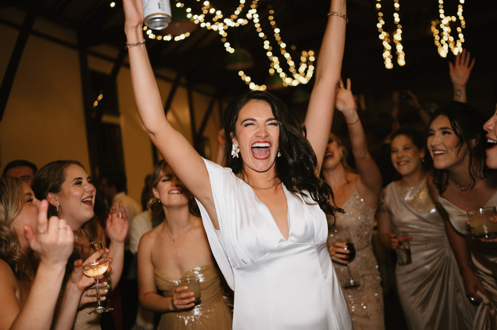 Bride sings and dances during wedding reception