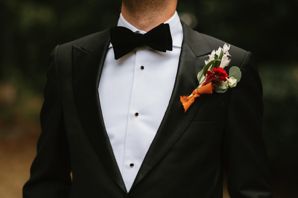 close up detail of Groom's suit on his wedding day 