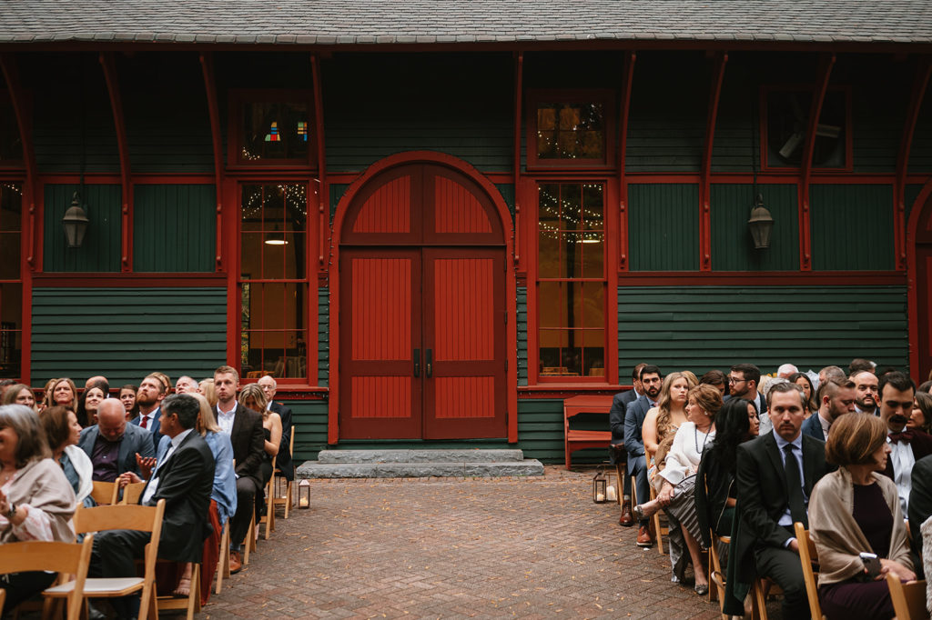 guests wait for ceremony to begin at Trolly Barn