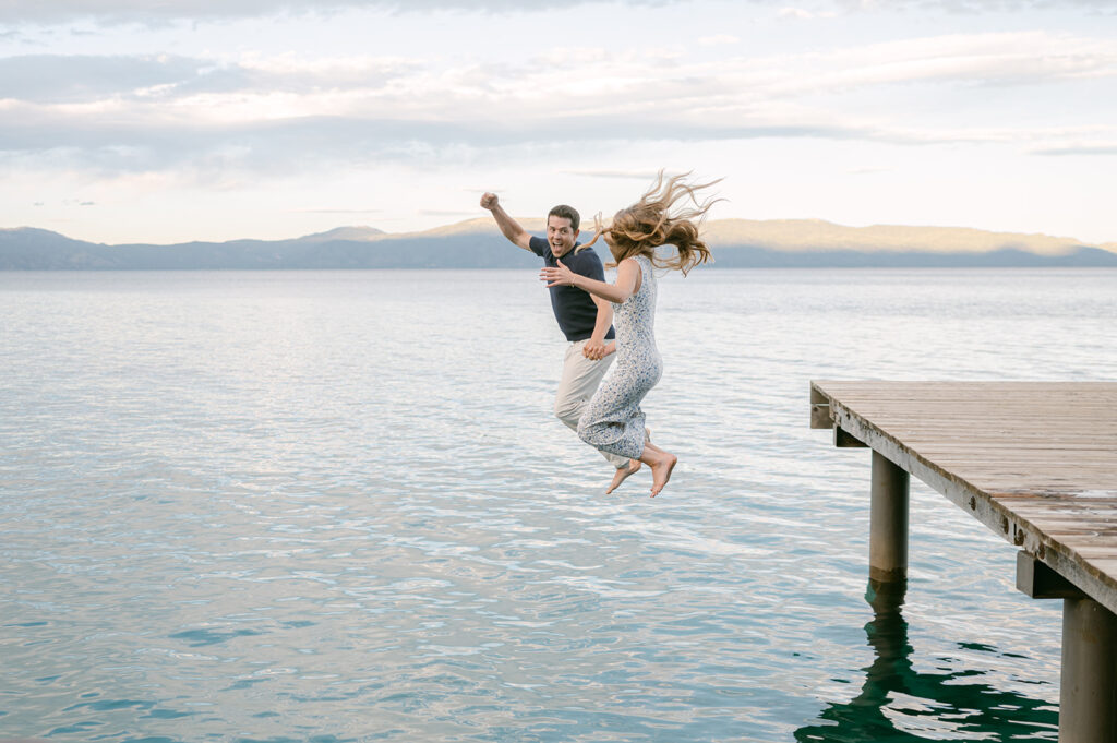 Couple jumps into Lake Tahoe during their engagement photos by Sarah Woods.