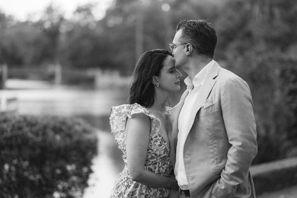 Black and white engagement photo at Magnolia Gardens in Charleston.