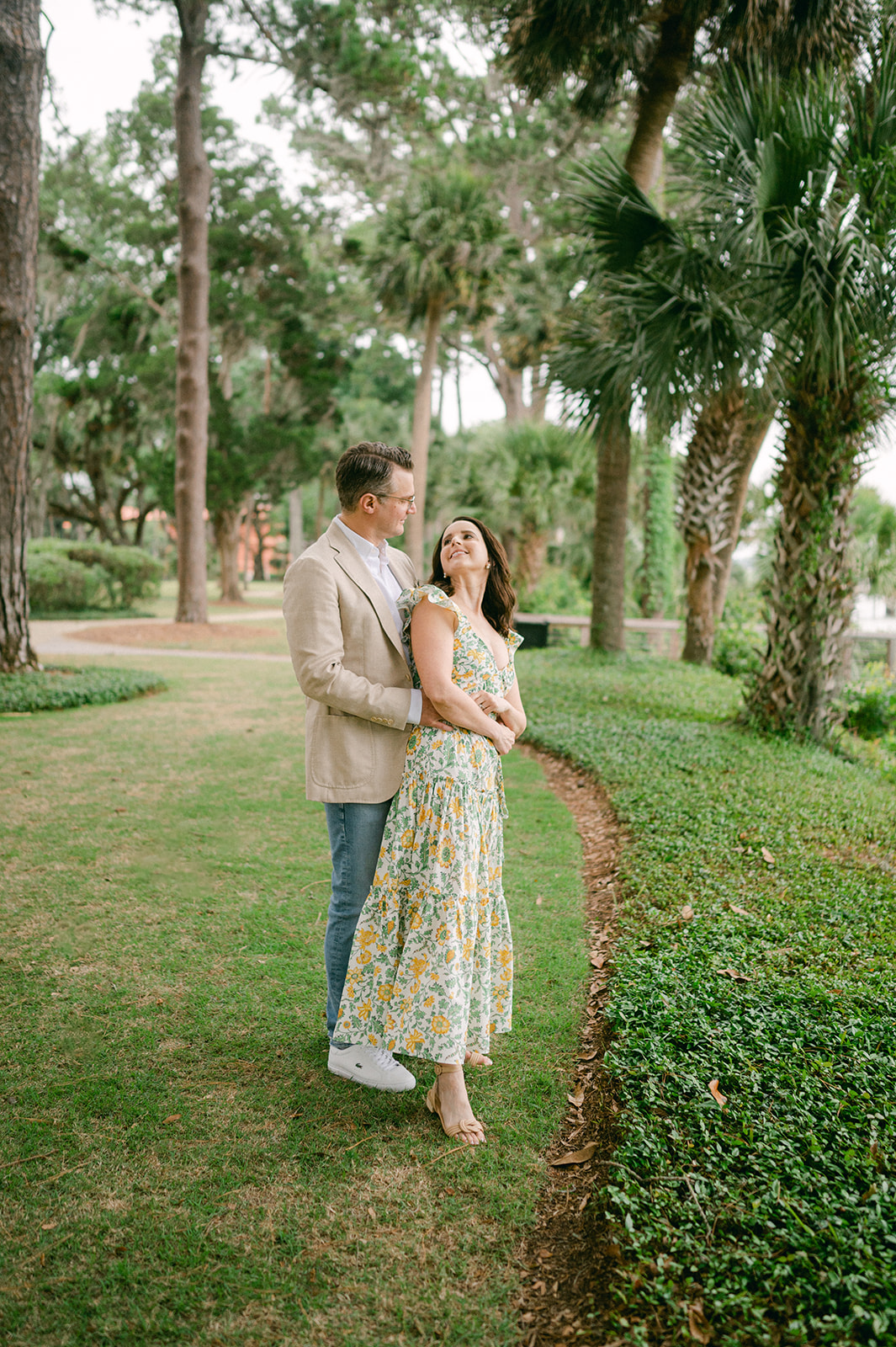 Couple hugging during their Palmetto Bluff photoshoot to celebrate their anniversary.