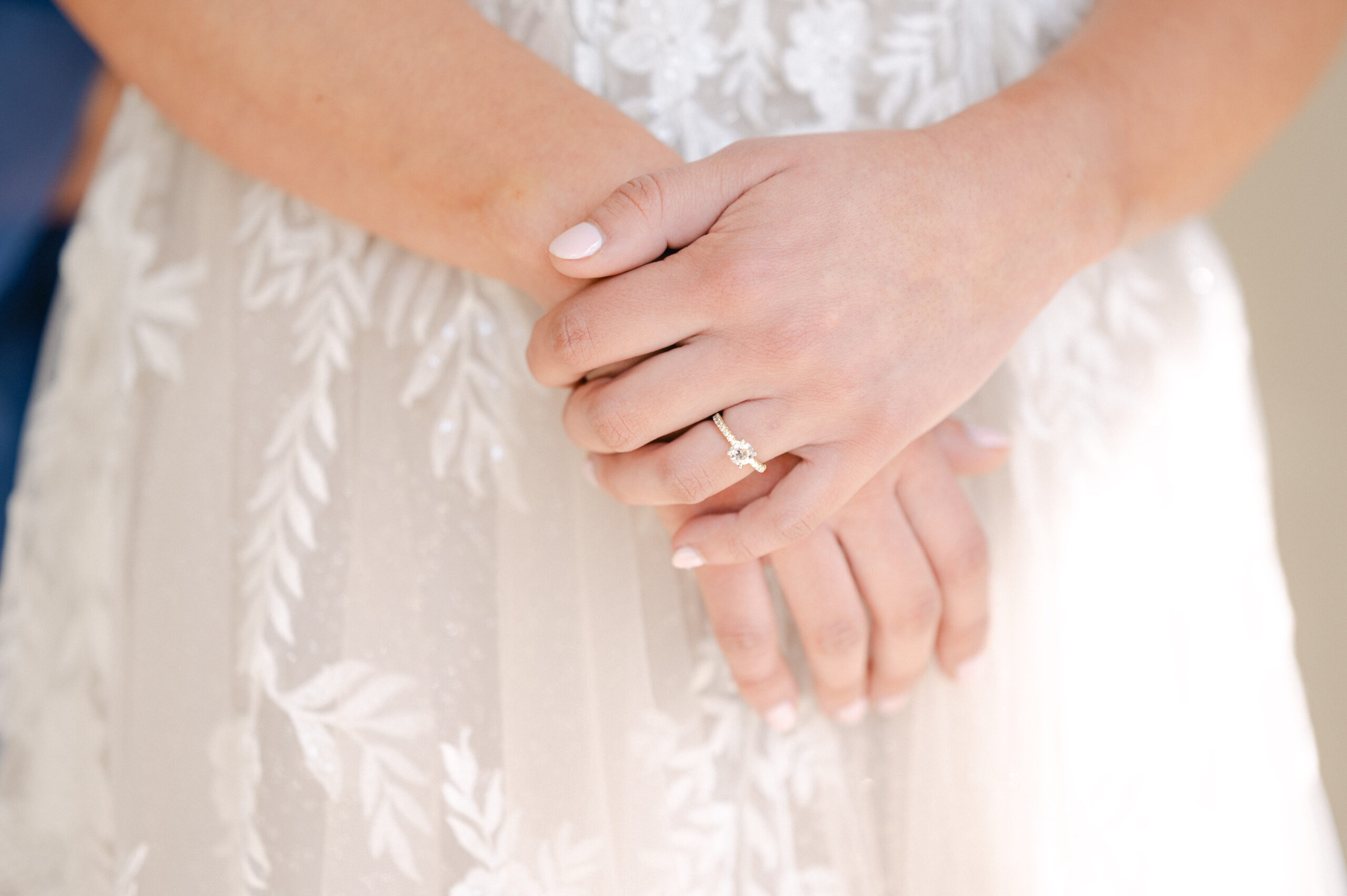 Bride wearing her engagement ring on her wedding day.