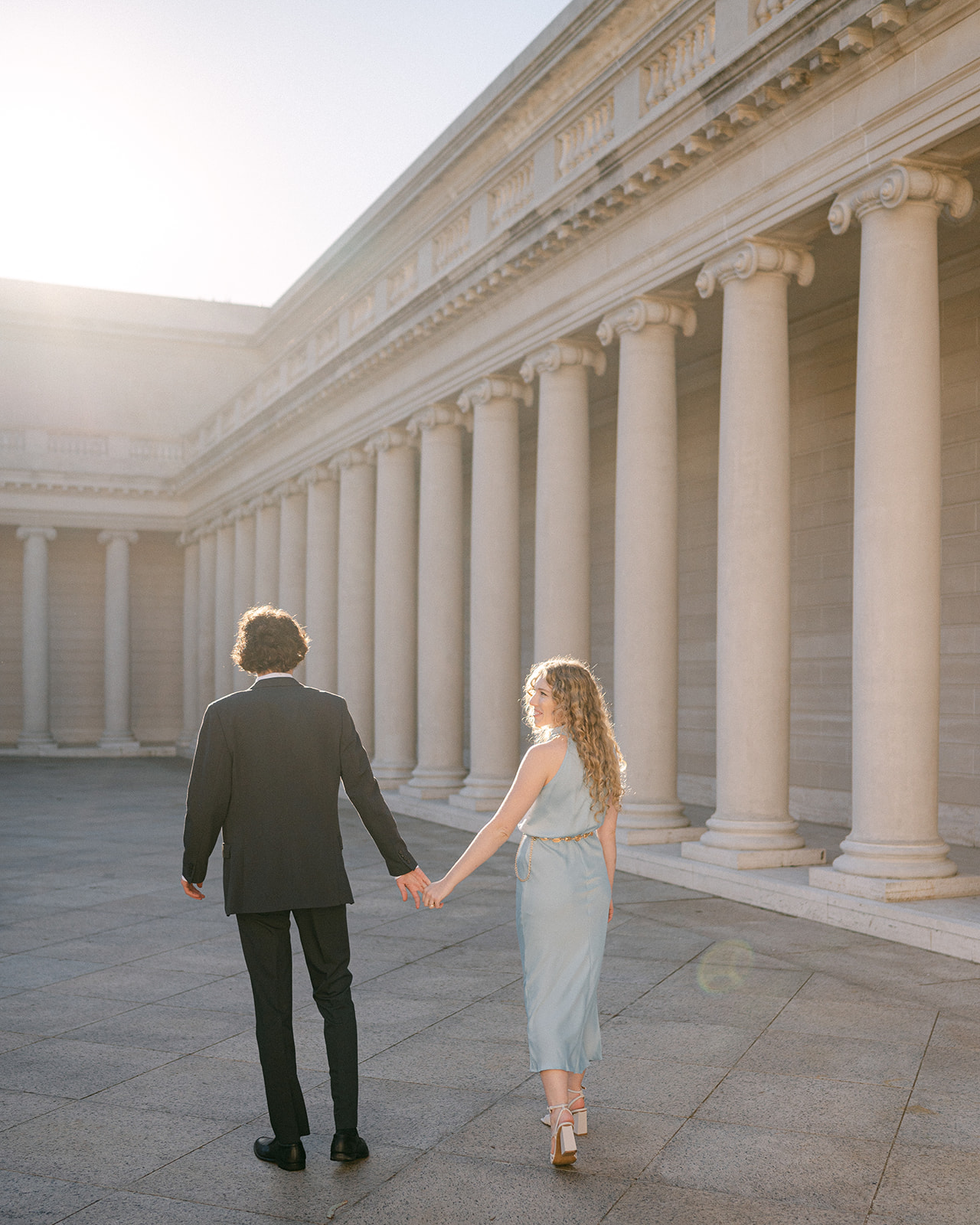Candid and romantic engagement photo at Legion of Honor in San Francisco. 