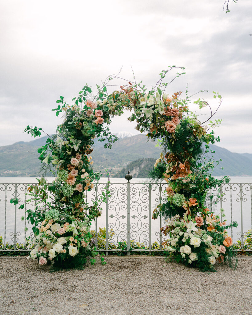 Pastel and greenery wedding ceremony arch at Villa Cipressi in Lake Como, Italy. 