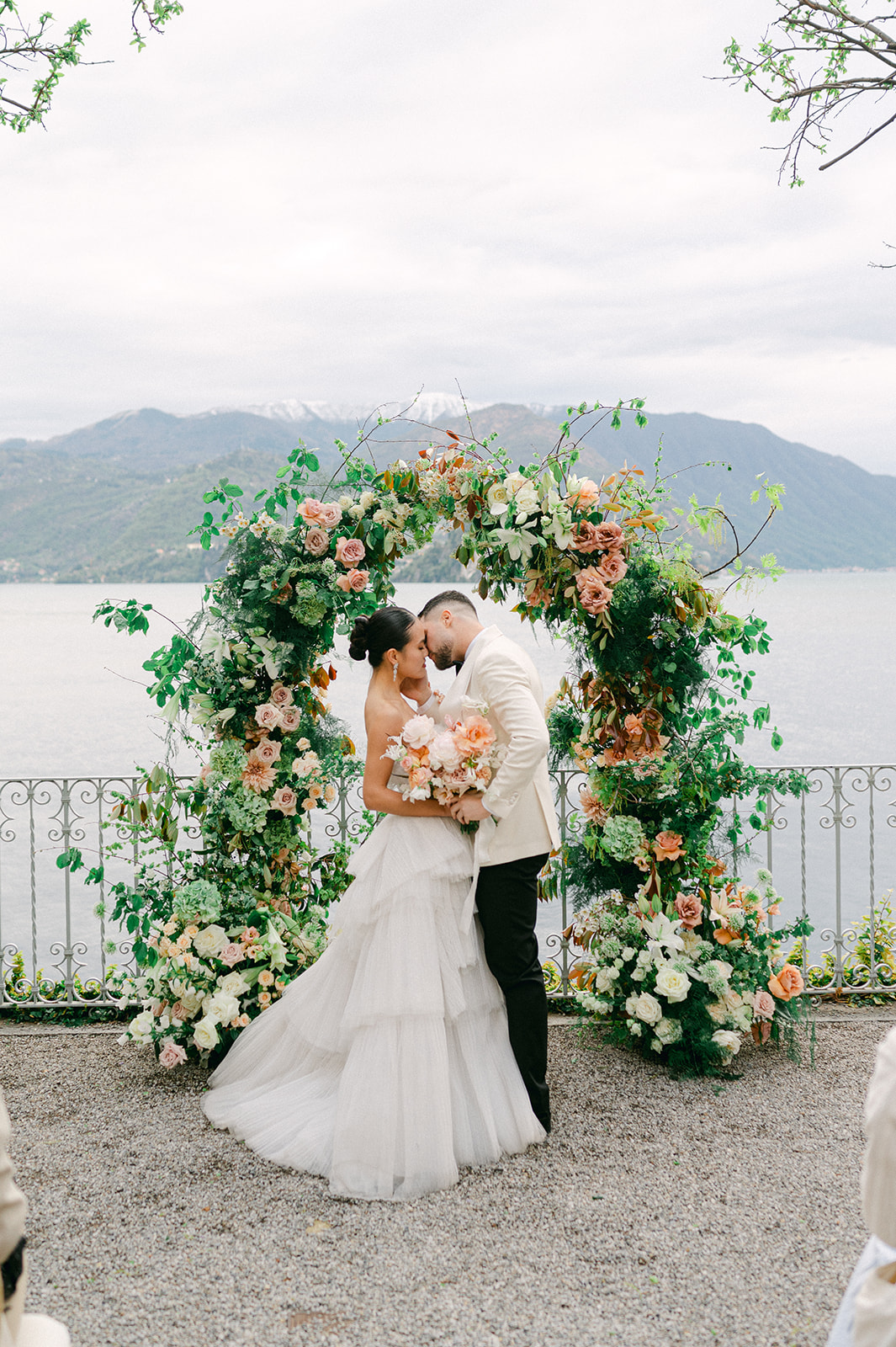 Luxury fine art wedding ceremony with a floral arch at Hotel Villa Cipressi in Lake Como, Italy. 
