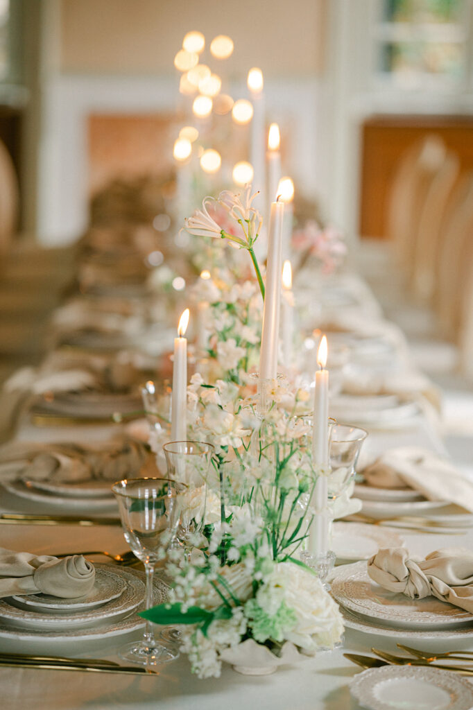 Romantic pastel and greenery wedding tablescape with candles at Villa Cipressi in Lake Como, Italy. 