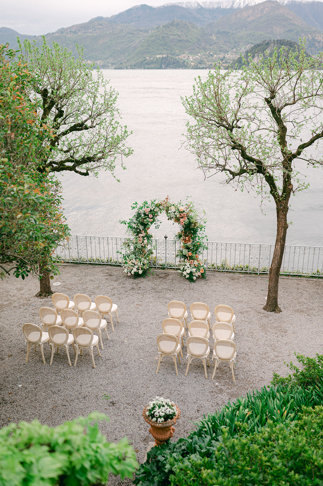 Romantic, outdoor garden wedding ceremony in Lake Como Italy captured by destination wedding photographer Sarah Woods. 