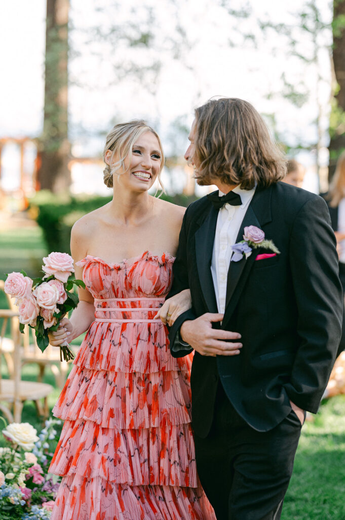 Bridesmaid and groomsmen walking down the aisle at a whimsical garden wedding in Lake Tahoe. 