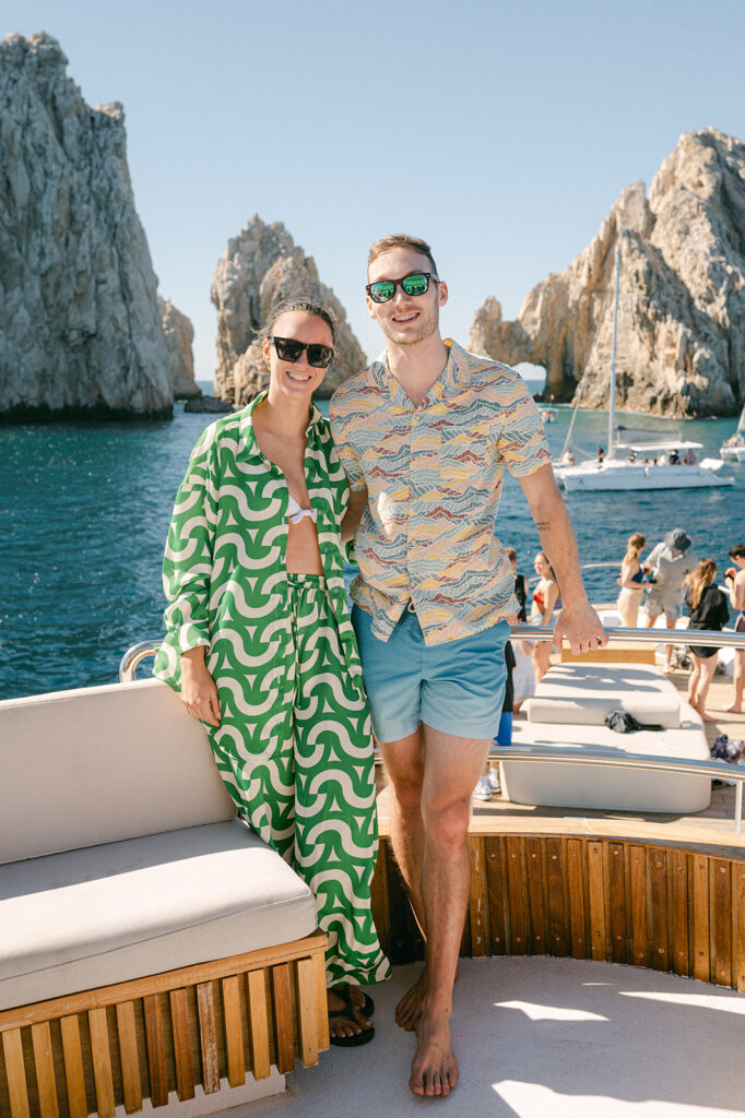 Bride and groom with their wedding party on a yacht in Cabo for their multi-day destination wedding.