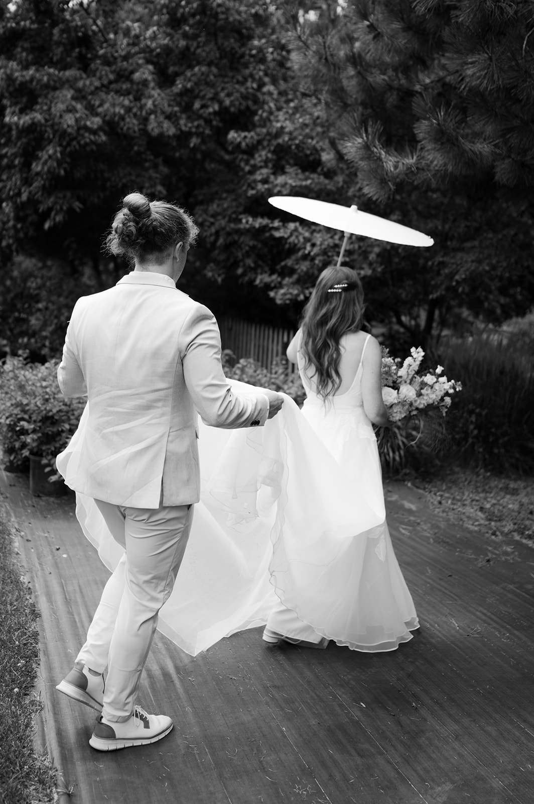 Black and white documentary style bride and groom portrait at a garden wedding in Battle Lake, MN. 