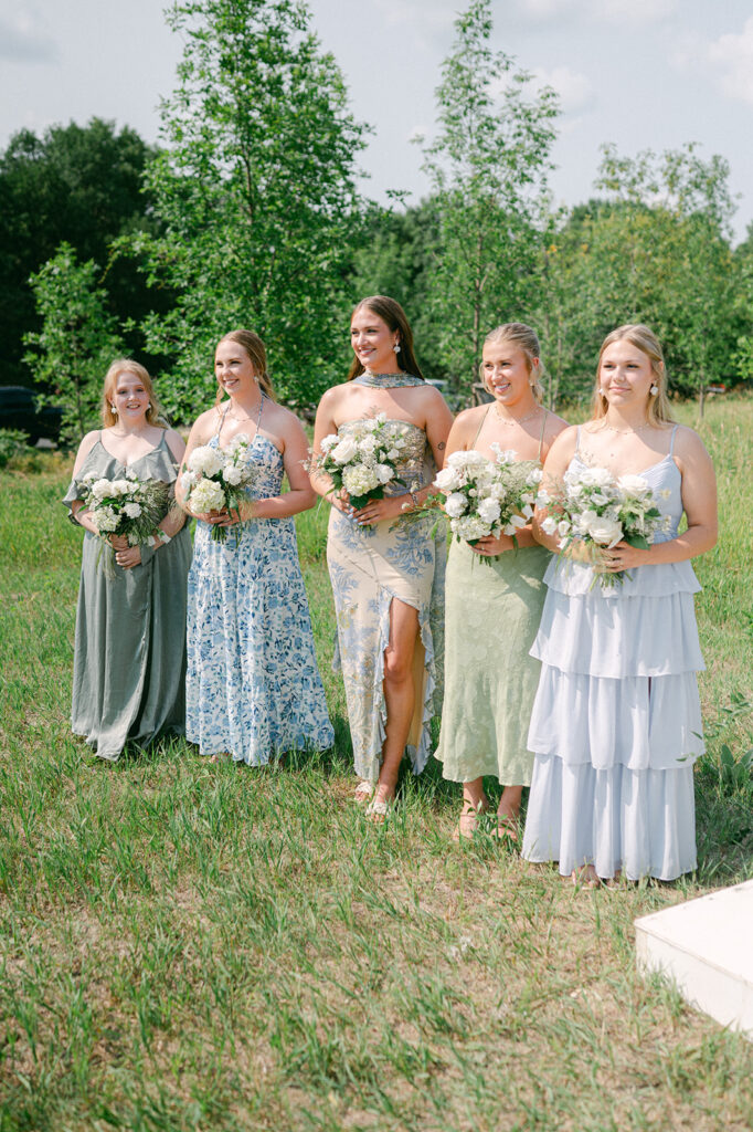 Bridal party standing by the altar watching the bride make her way down the aisle. 