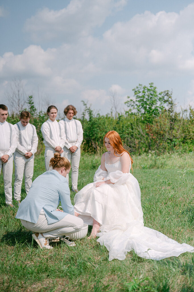 Foot washing ceremony at a garden party wedding in Battle Lake, MN. 