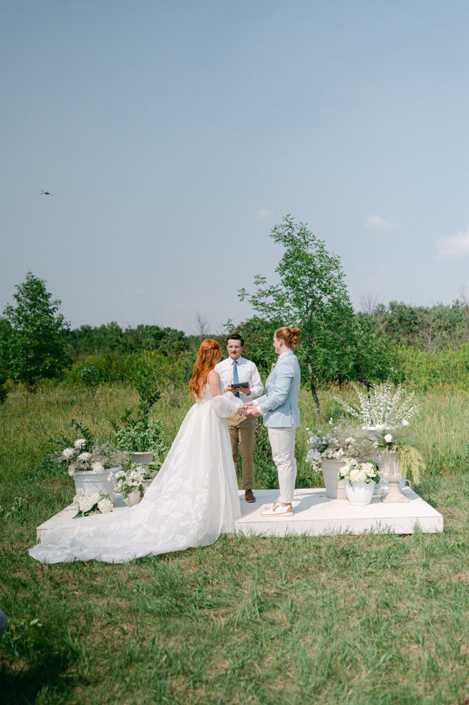 Outdoor ceremony in a field at a garden party wedding in Battle Lake, MN. 