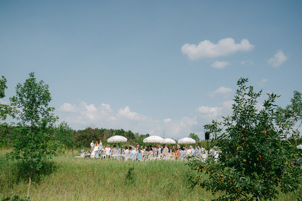 Garden party wedding ceremony in an open field at Battle Lake, MN. 