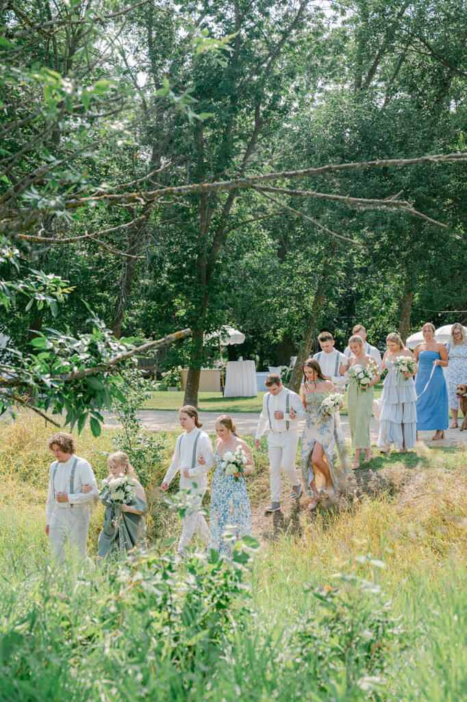 Bridal party processional at a romantic garden party wedding in MN. 