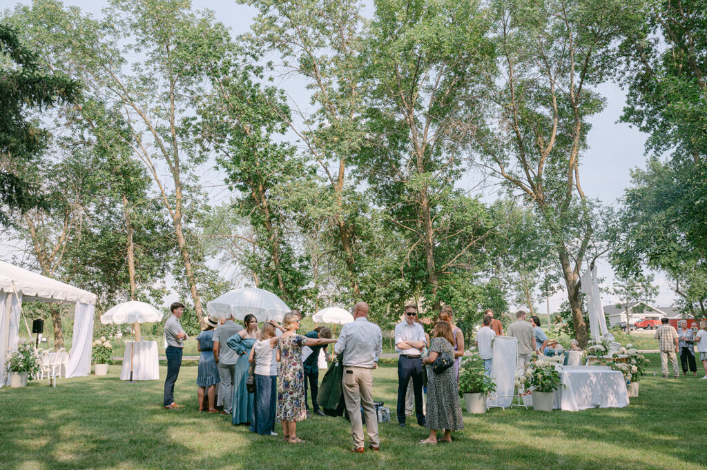 Cocktail hour at a summer garden party wedding at Battle Lake, Minnesota. 