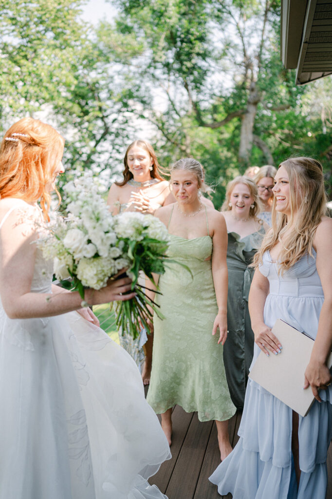 Candid bridesmaid first look.