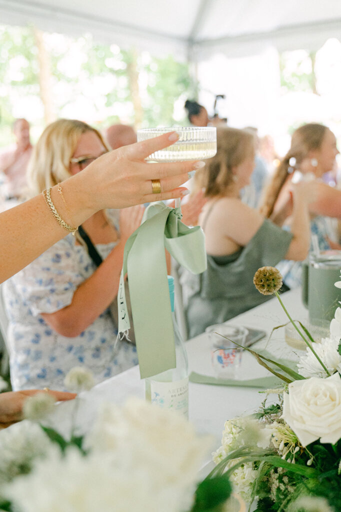 Guests raising their glasses during the speeches.