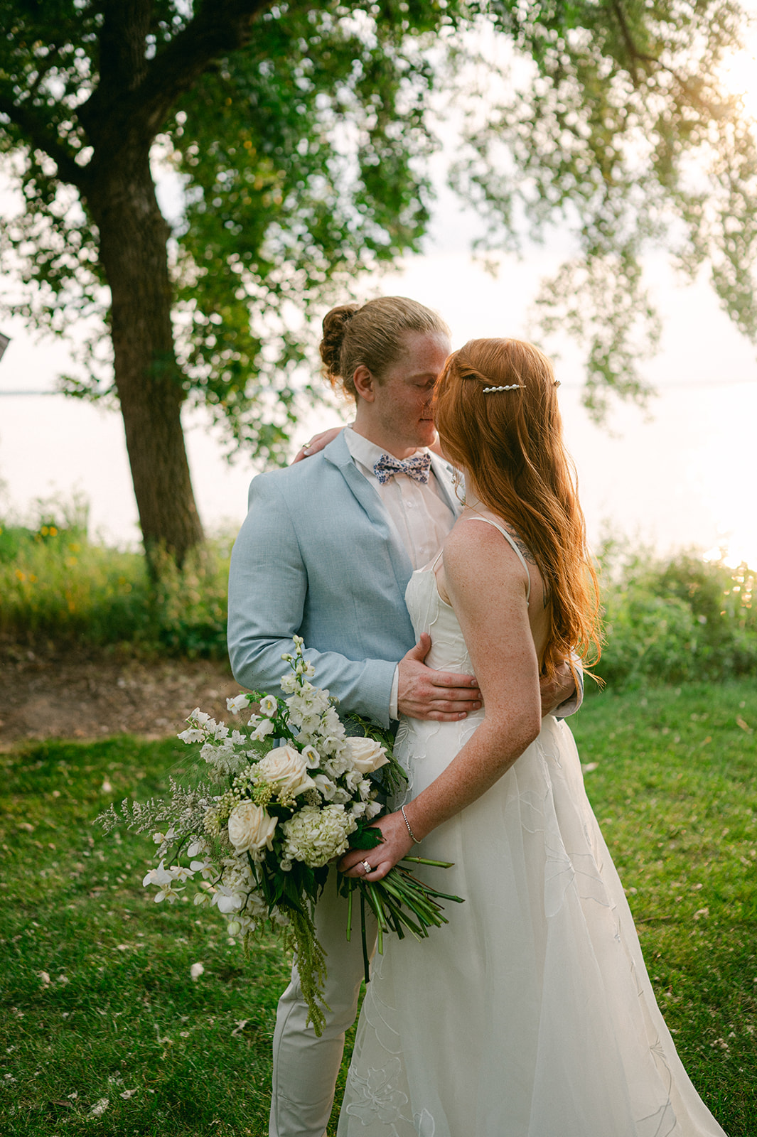 Bride and groom sunset portrait at their garden wedding at Battle Lake, MN. 