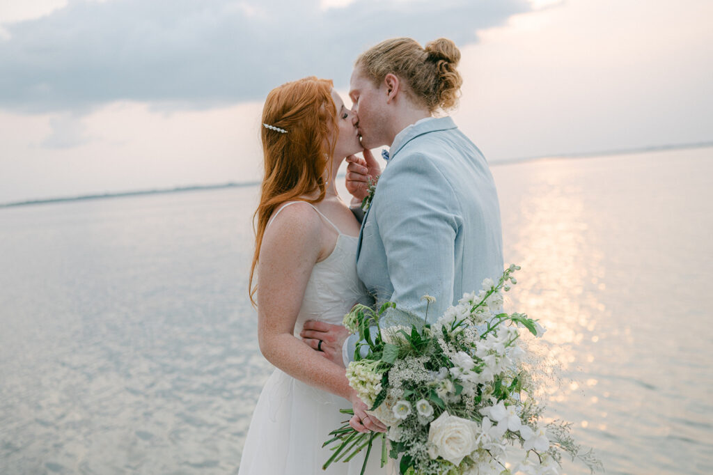 Bride and groom sunset kissing portrait at Battle Lake, MN. 