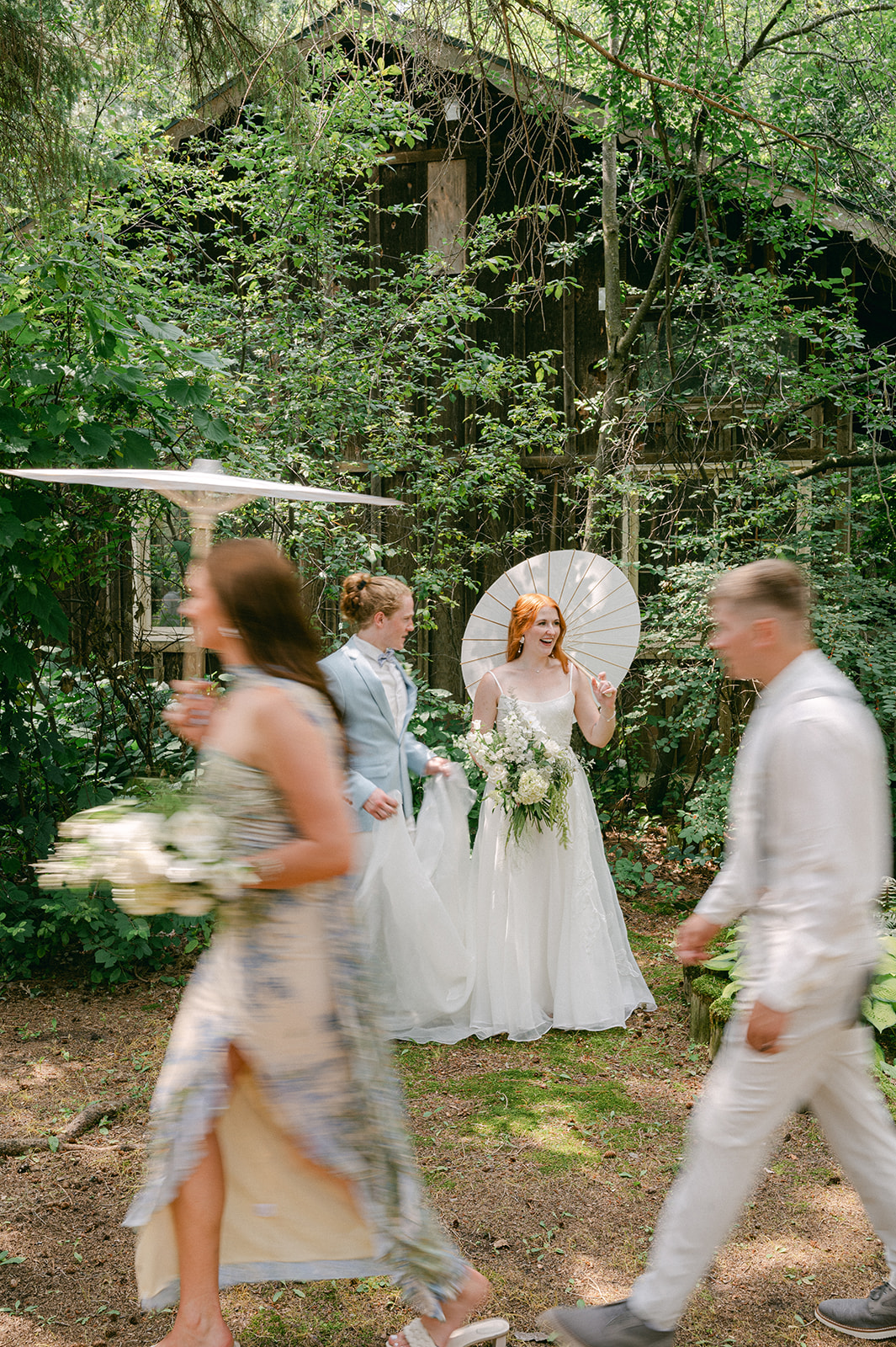 Motion blur wedding party portrait in the garden.