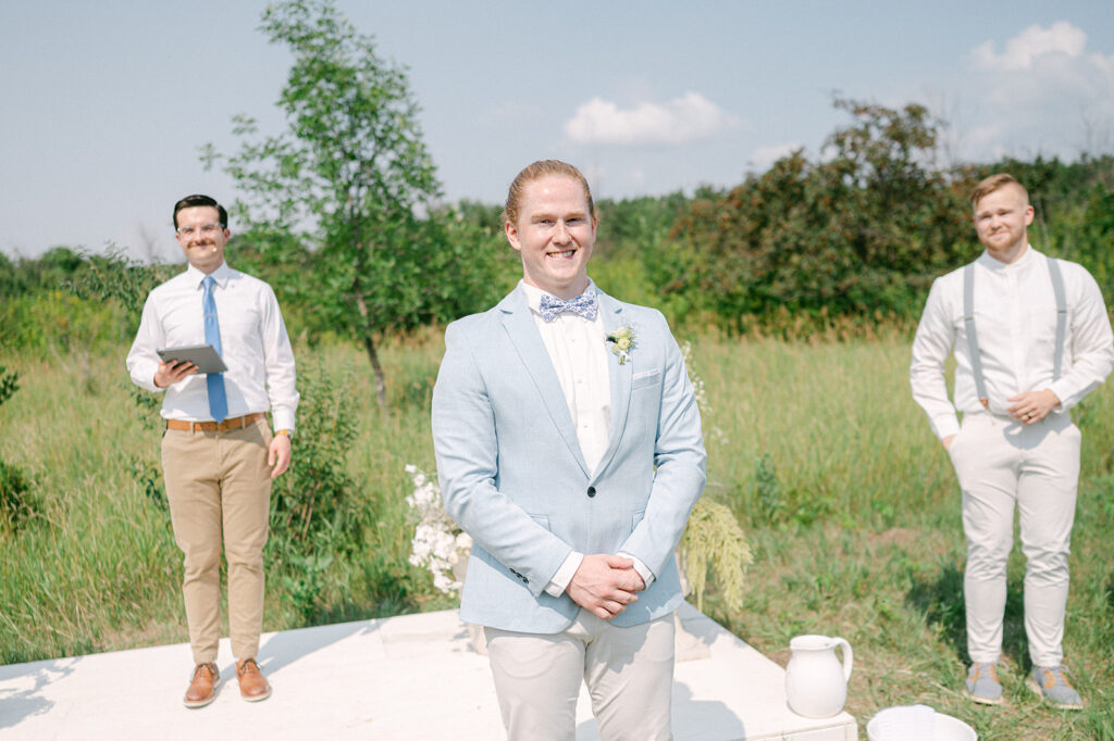 Groom's first look reaction to the bride walking down the aisle. 