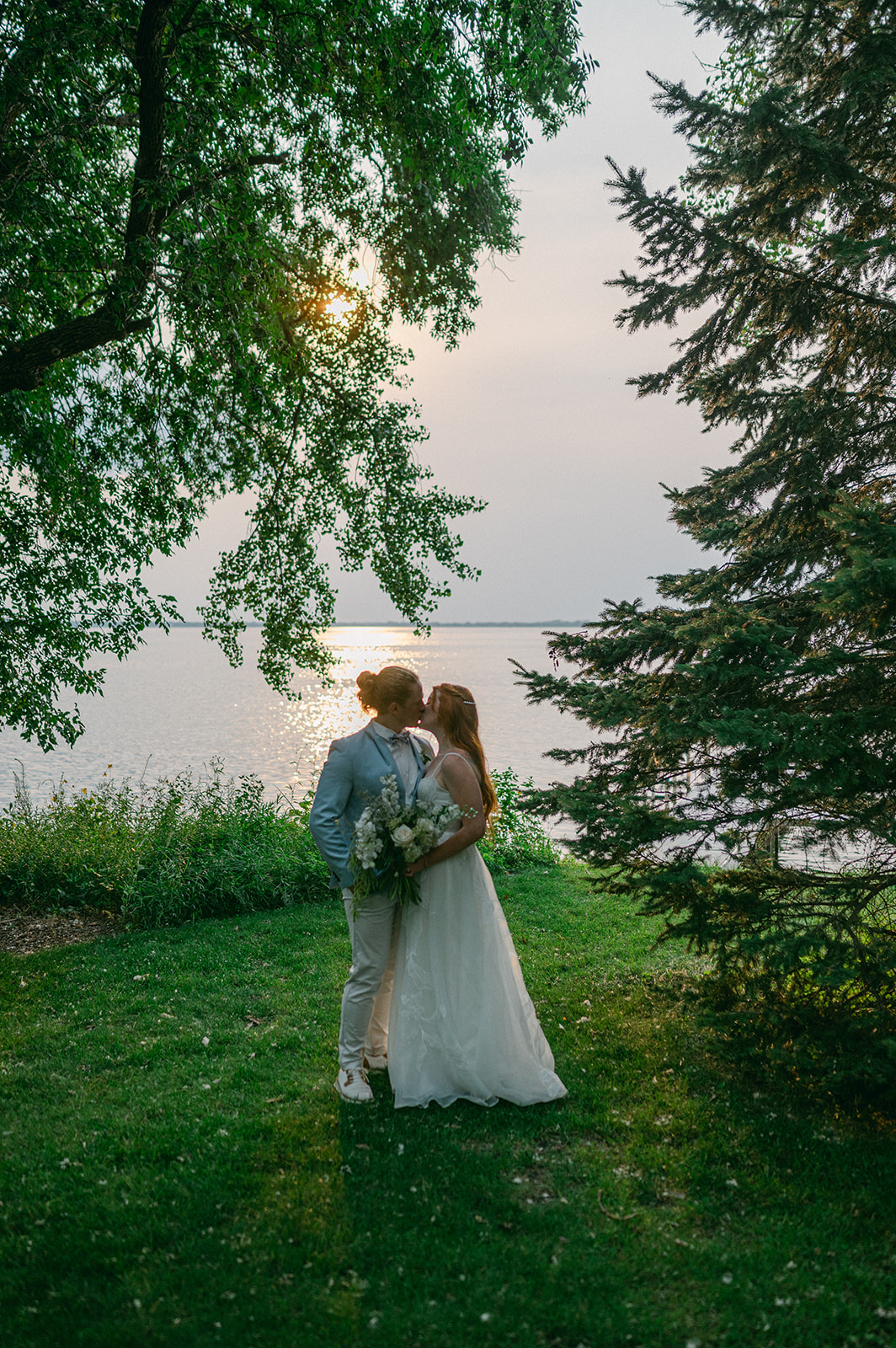 Garden party wedding bride and groom sunset portrait at Battle Lake, MN. 