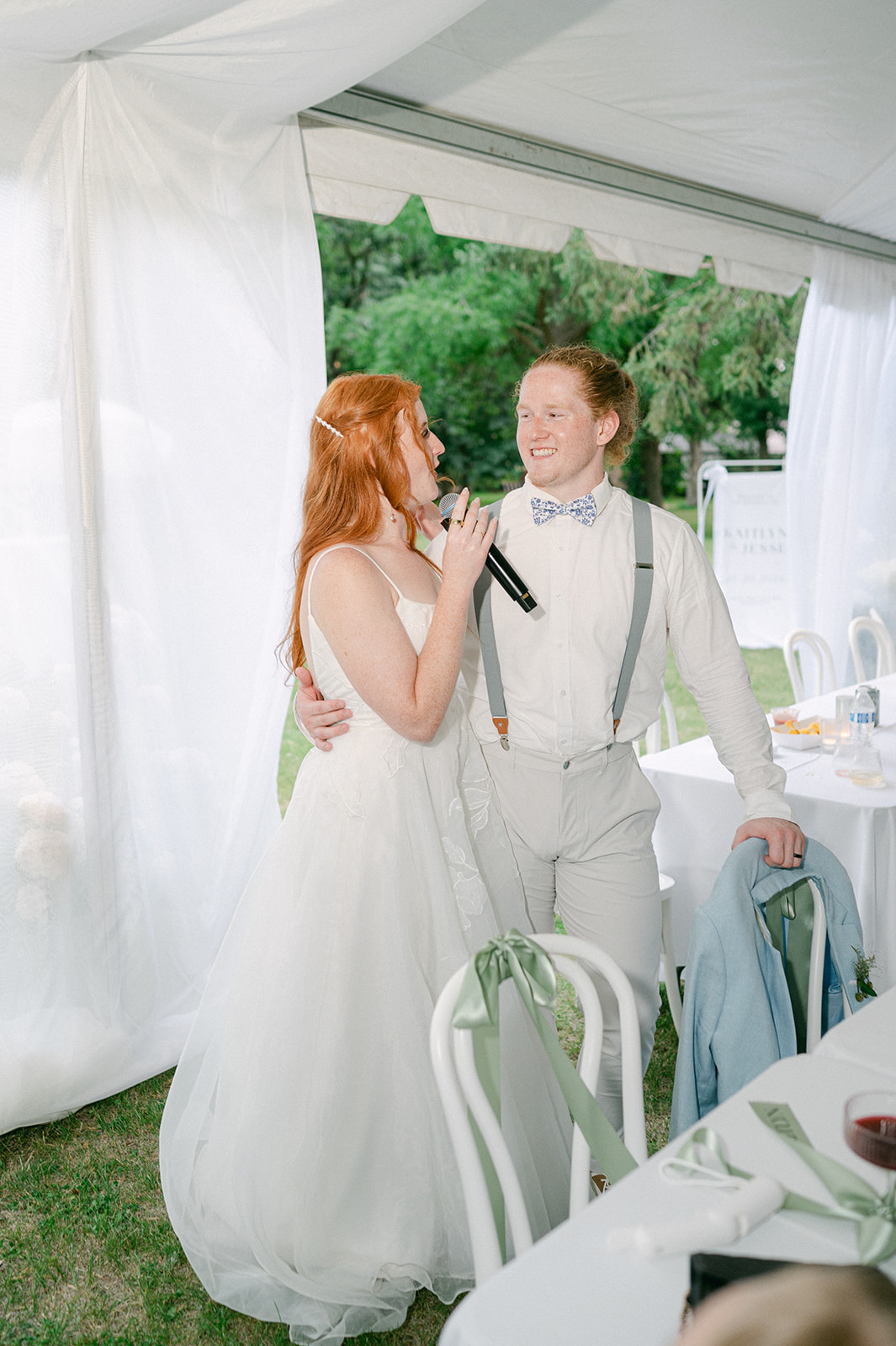 Bride and groom giving a speech at their reception dinner. 