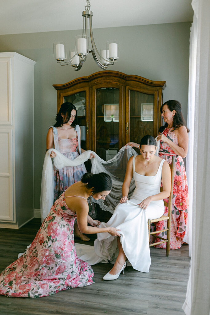 Documentary style photography of a bride getting ready with her bridesmaids. 