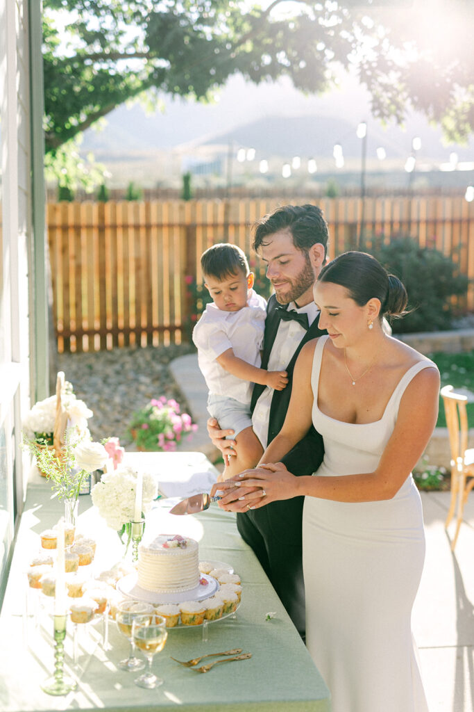 Bride and groom cutting their wedding cake at their backyard wedding in Lake Tahoe. 