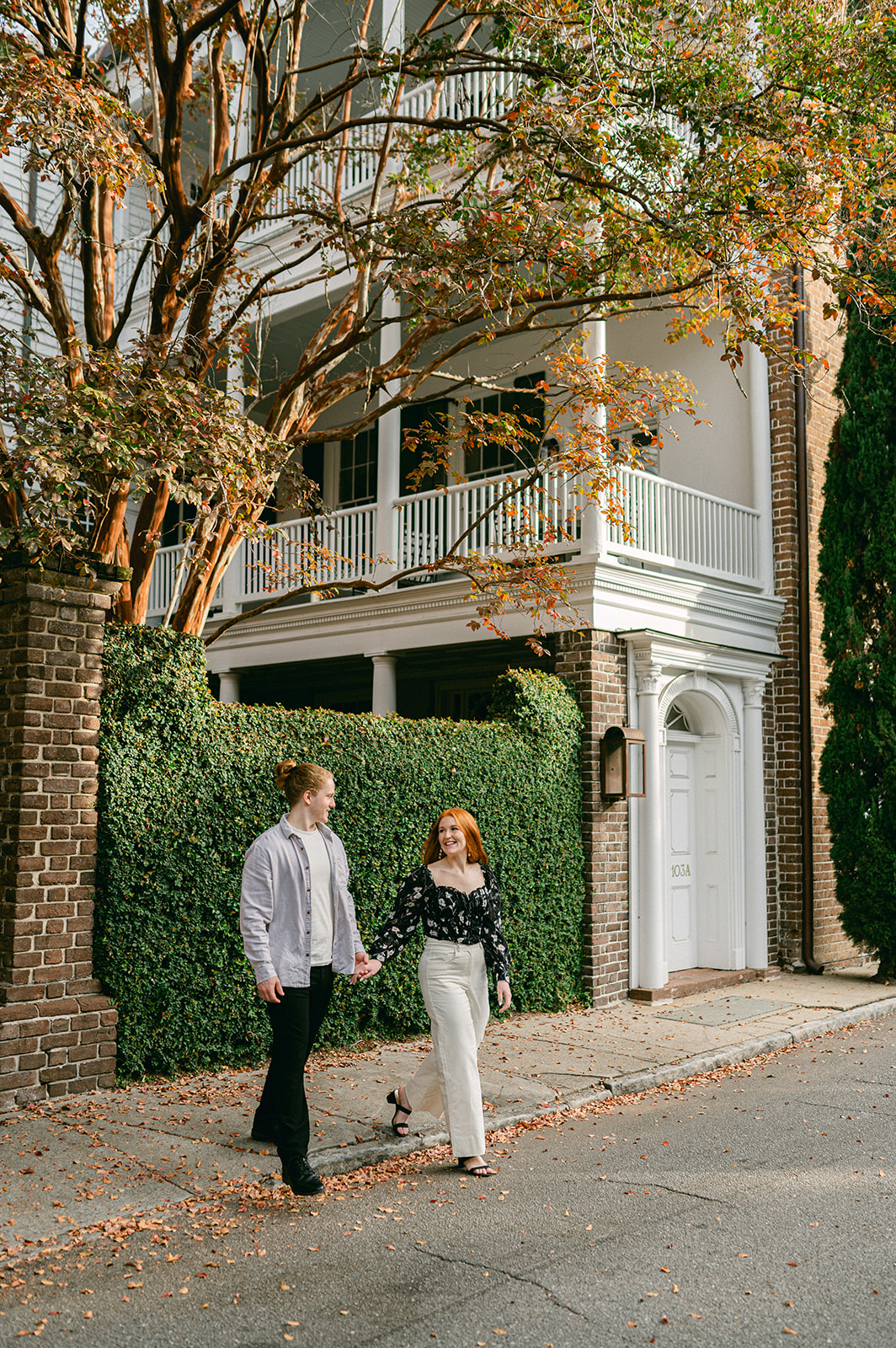 Candid downtown Charleston engagement session captured by Sarah Woods Photography. 