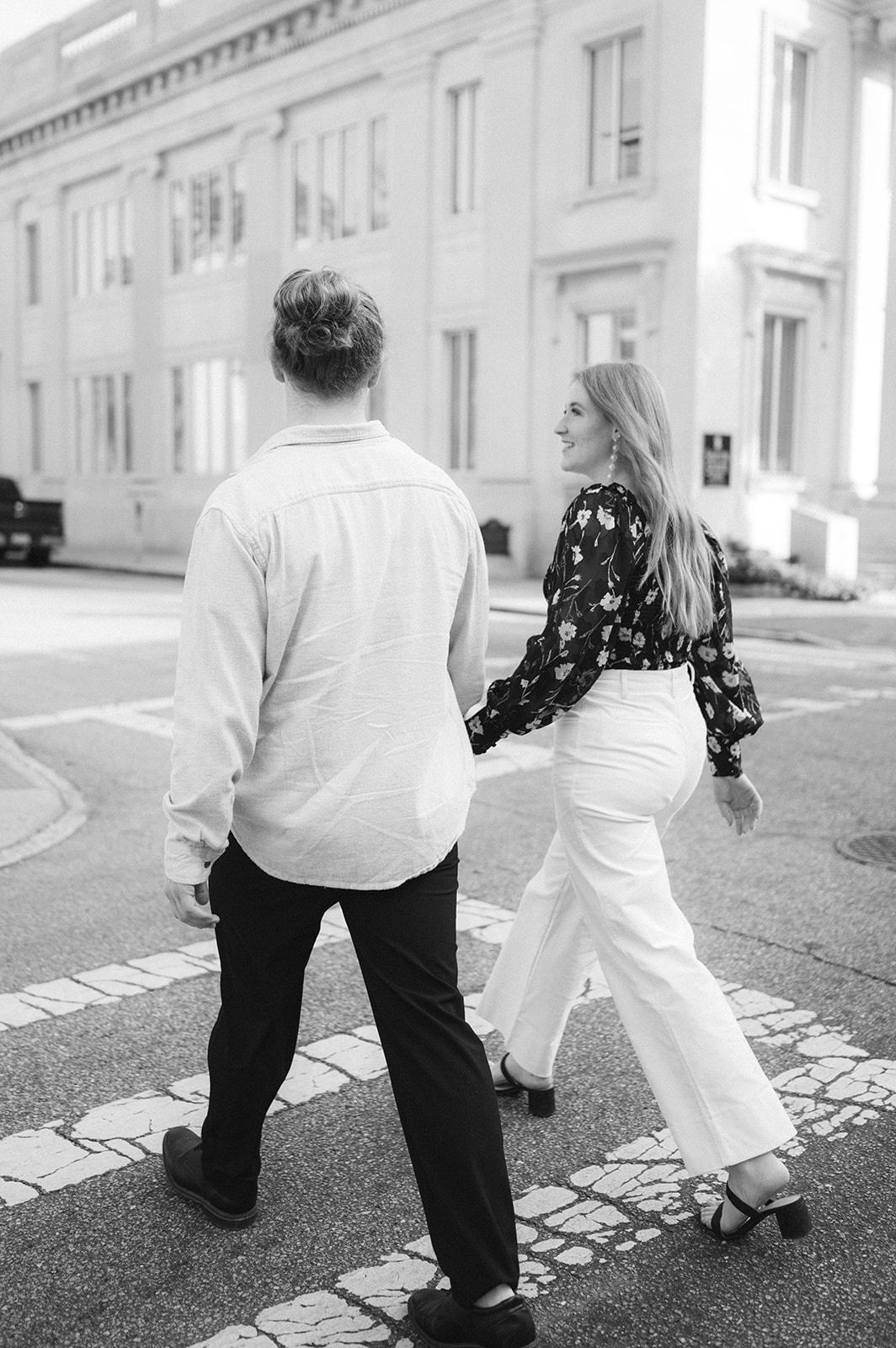 Documentary style downtown Charleston engagement photo. 