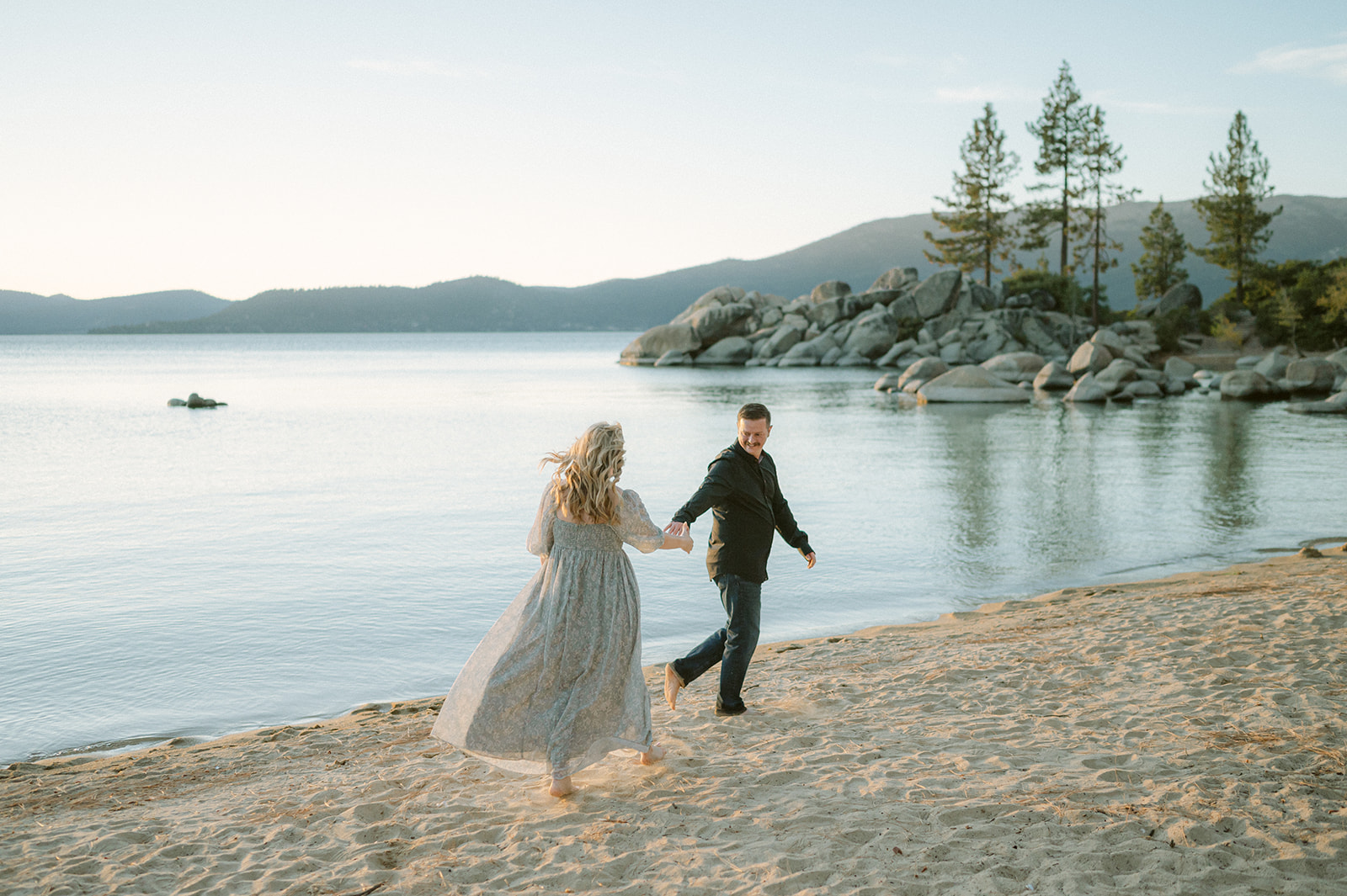 Documentary style engagement photos at Sand Harbor. 