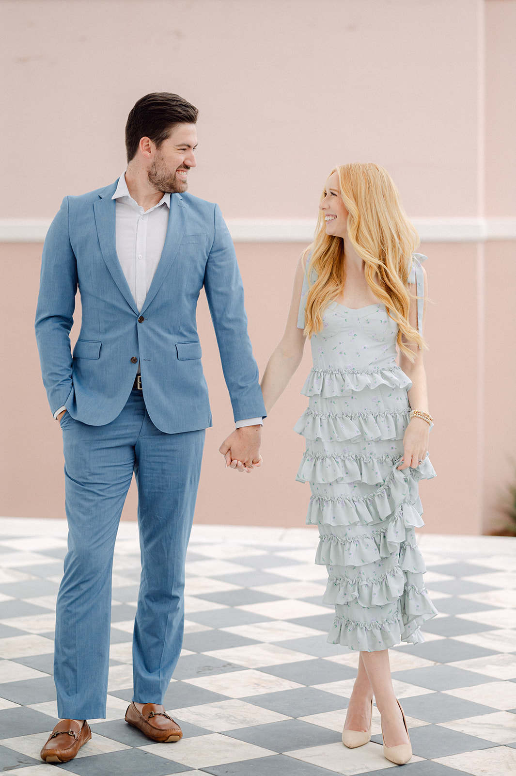 Spring engagement photo outfit idea: blue midi dress and blue suit. 