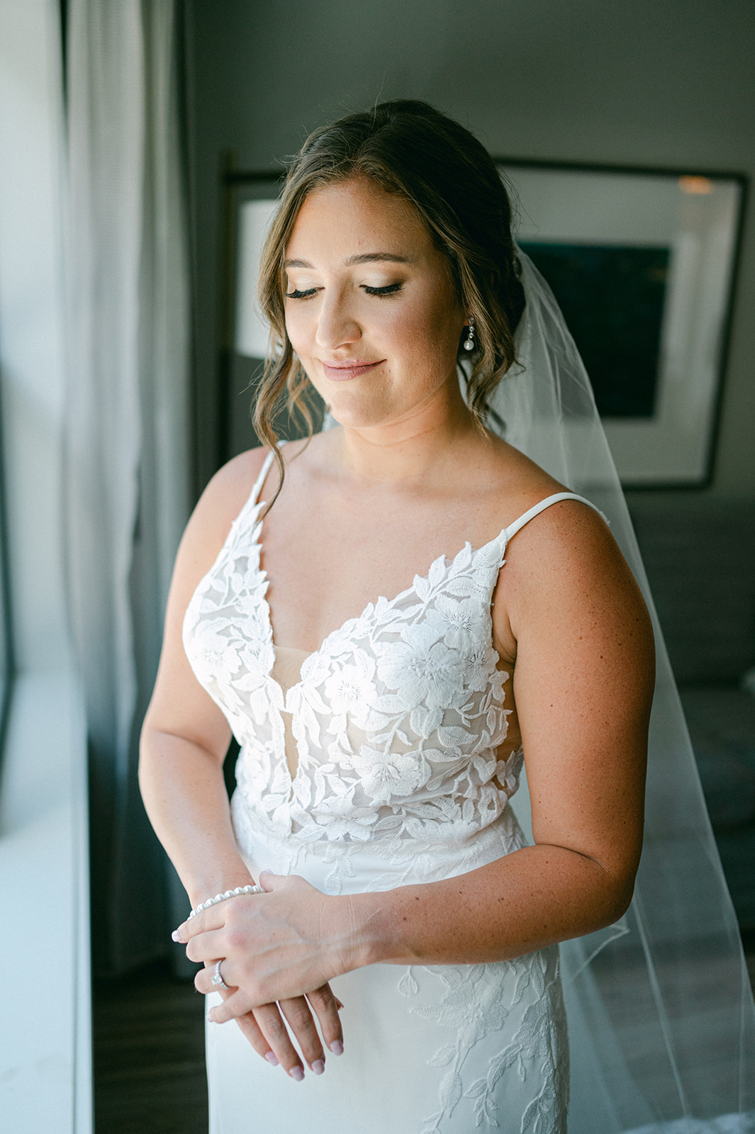 Elegant bridal portrait in front of a window at a Lake Tahoe wedding captured by Sarah Woods Photography.