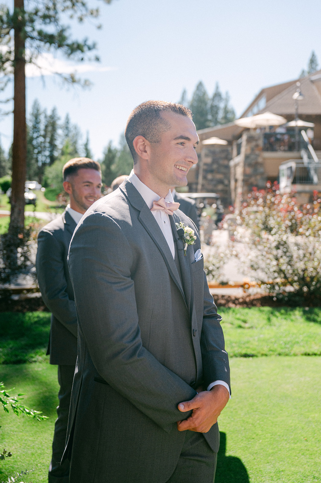 Emotional first look down the aisle at a scenic Lake Tahoe wedding ceremony.