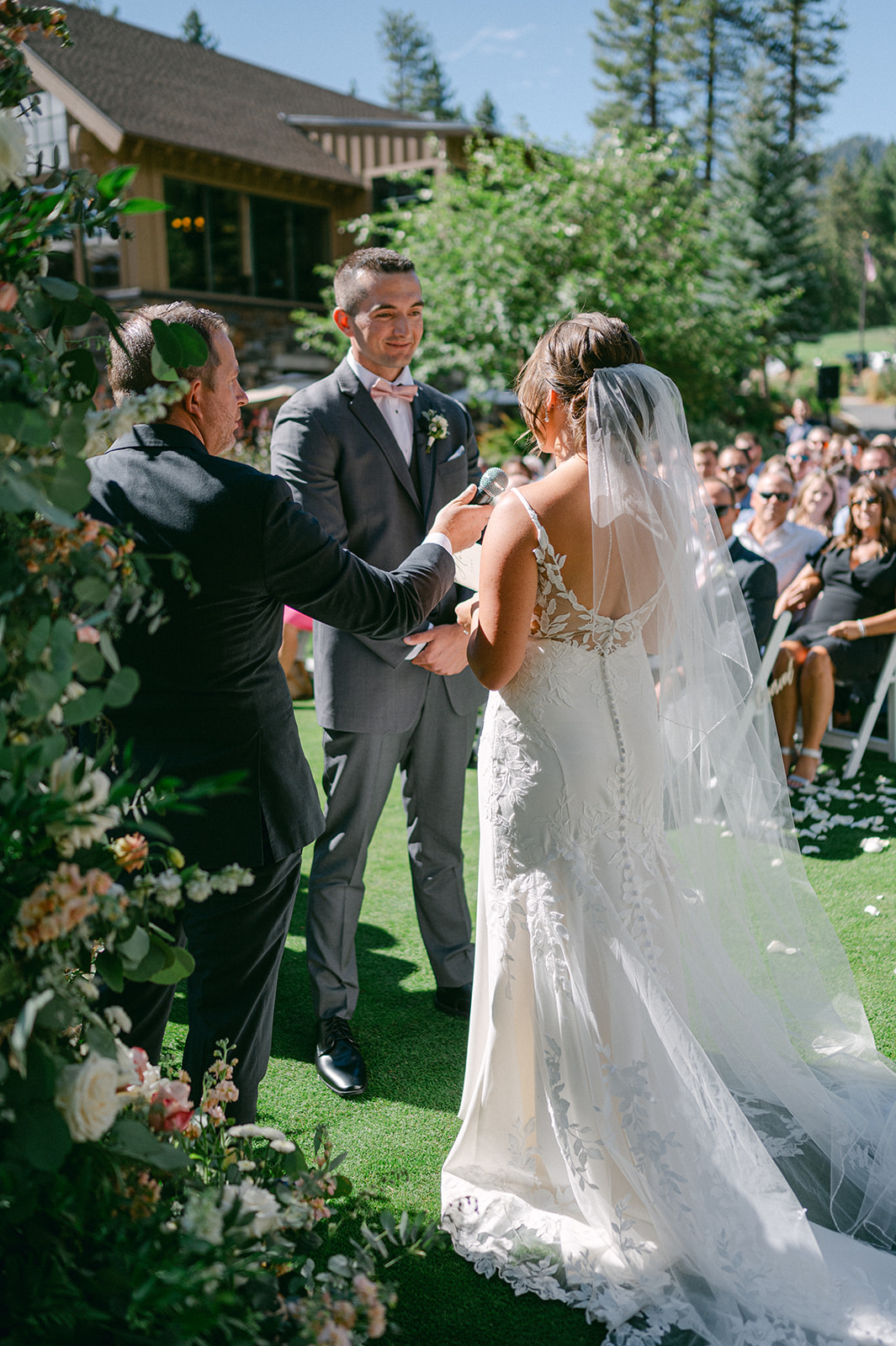 Golden sunlight filters through the trees during a heartfelt outdoor vow exchange in Lake Tahoe.