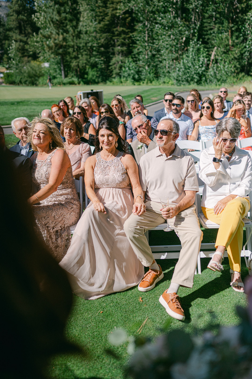 Guests watch as the couple says “I do” with Tahoe’s iconic scenery all around.