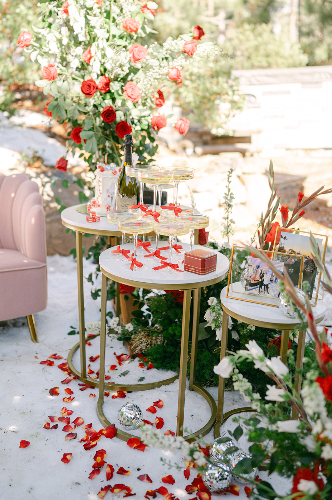 Proposal setup in Lake Tahoe with a champagne tower and red roses.