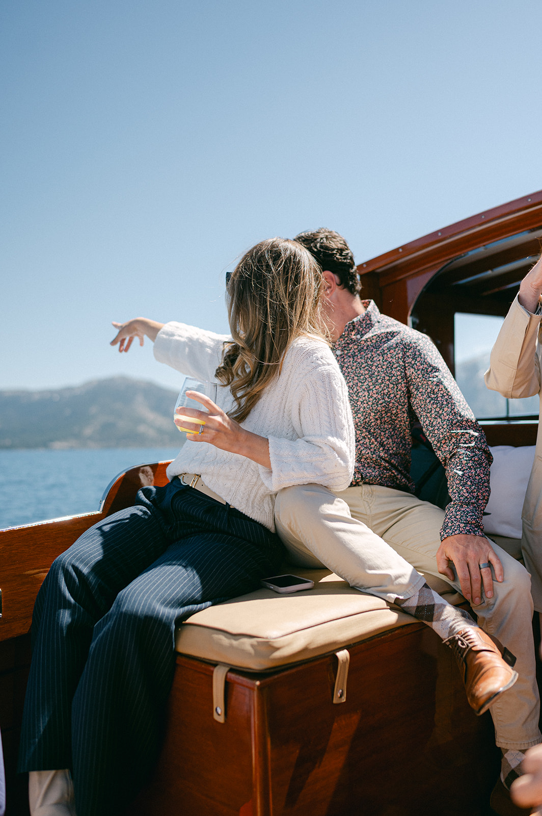 Wooden boat cruise at a Lake Tahoe luxury multi-day wedding.