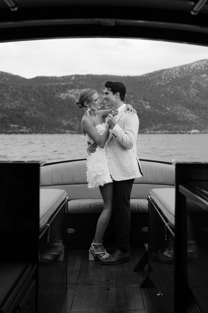 Candid bride and groom wedding photos on a wooden boat in Tahoe.