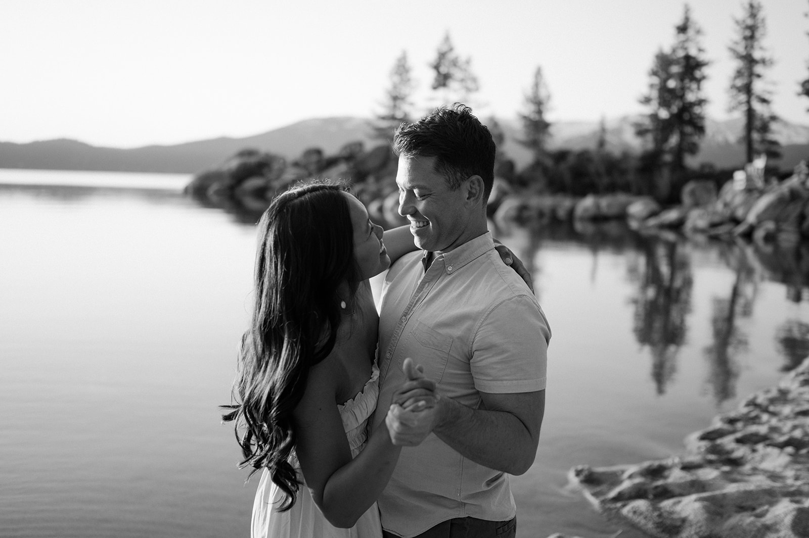 Black and white candid engagement photo — Lake Tahoe engagement photographer.