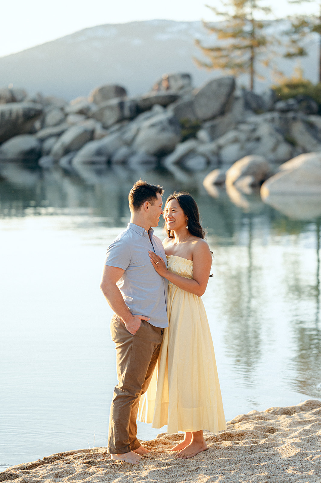 Beach engagement photo outfits — Butter yellow sundress, blue button-down and khaki pants.