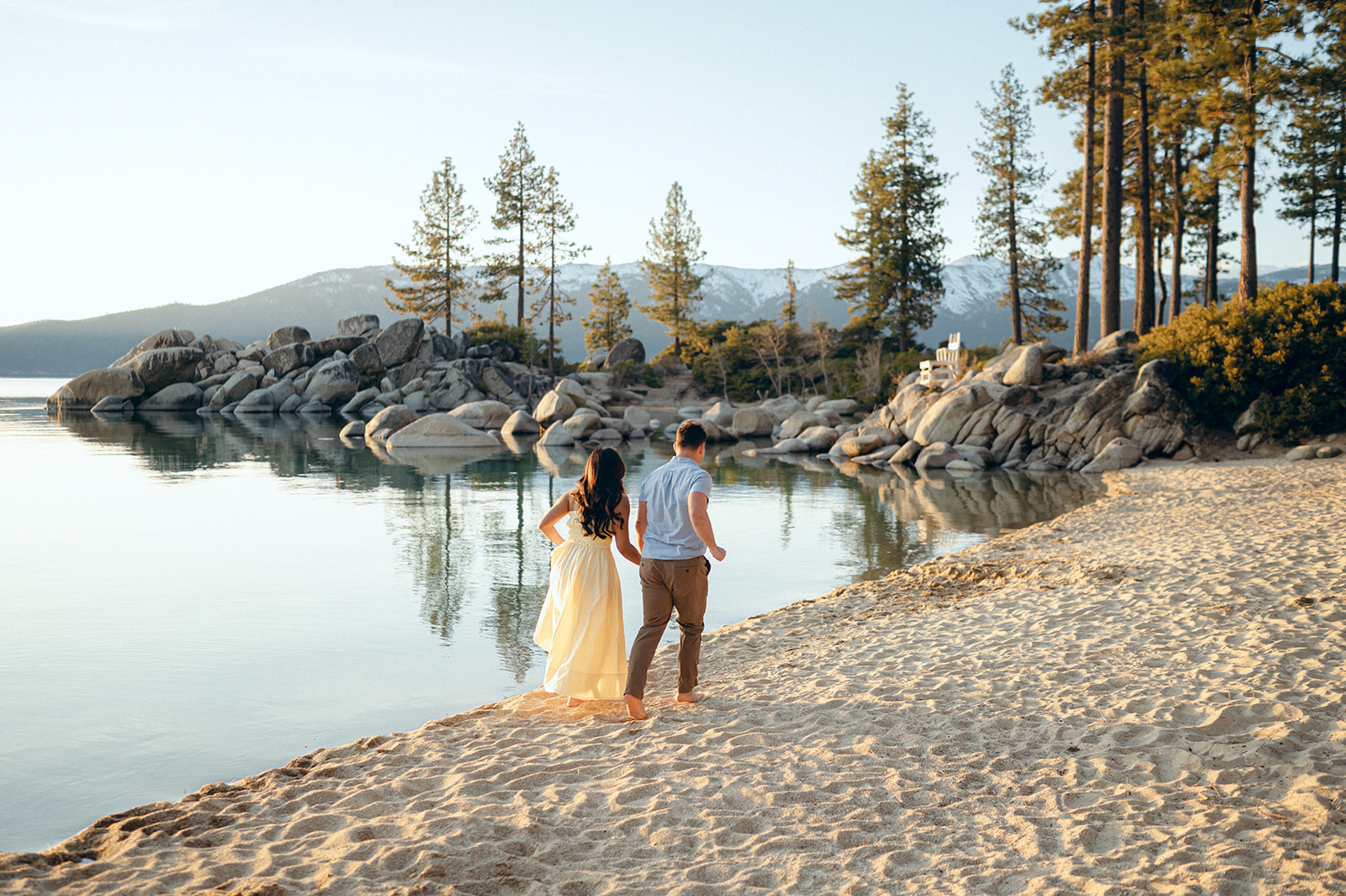 Couple walking on the beach at Sand Harbor.