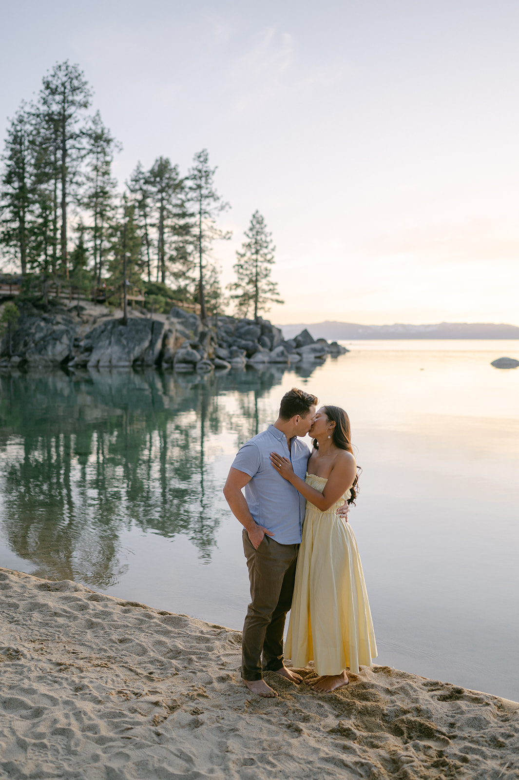 Couple kissing at sunset at Sand Harbor, Lake Tahoe.