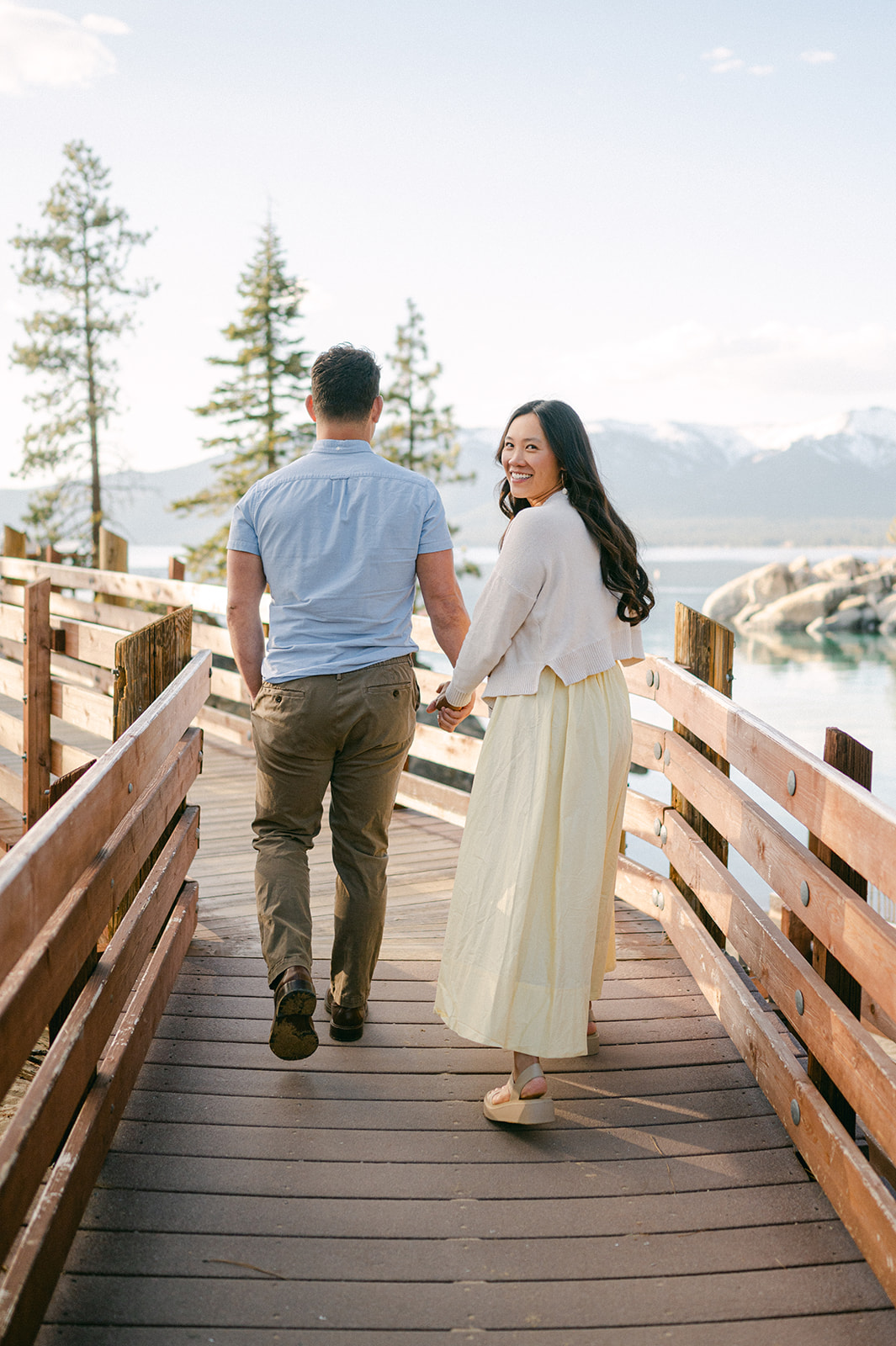 Couple walking on the boardwalk at Sand Harbor, Lake Tahoe.
